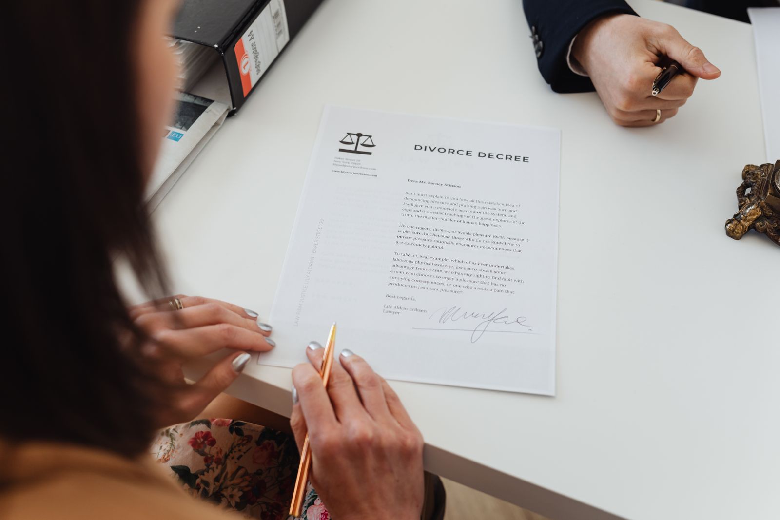 Spouses reviewing a divorce decree together during mediation